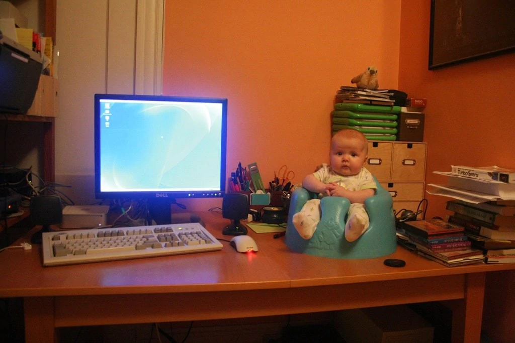 baby sitting on desk