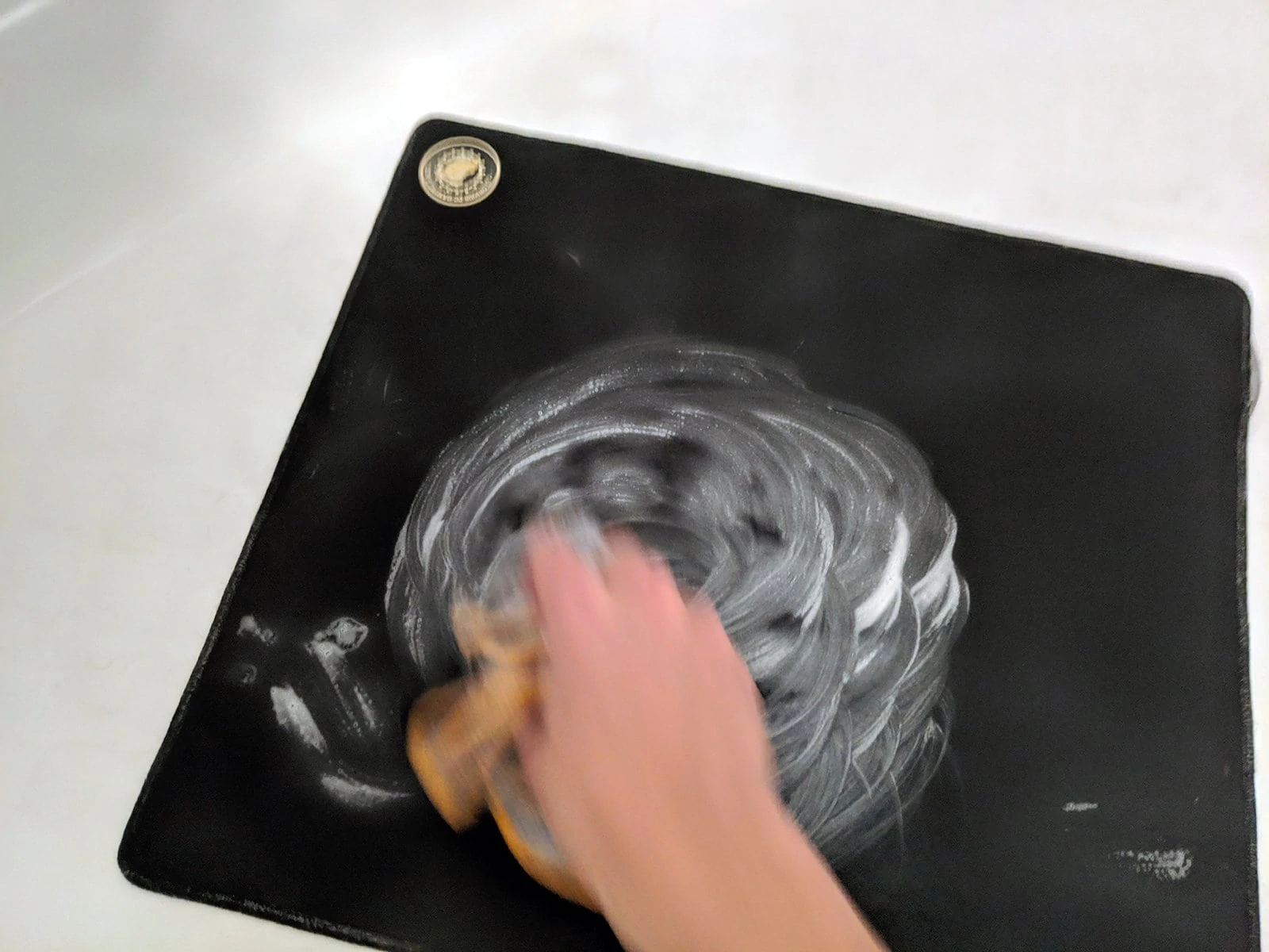 Scrub your mousepad clean with a microfiber cloth.