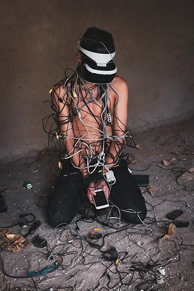 Man tangled in cables.