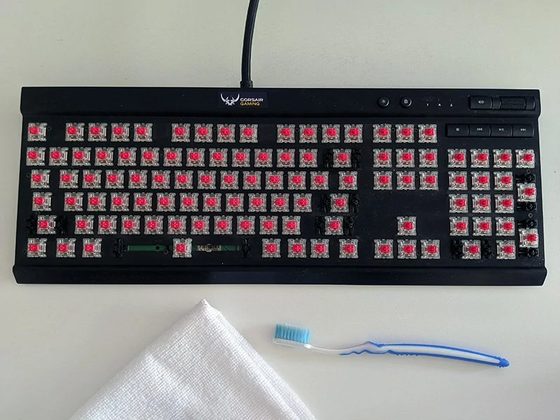 mechanical keyboard with keycaps removed, ready to be cleaned
