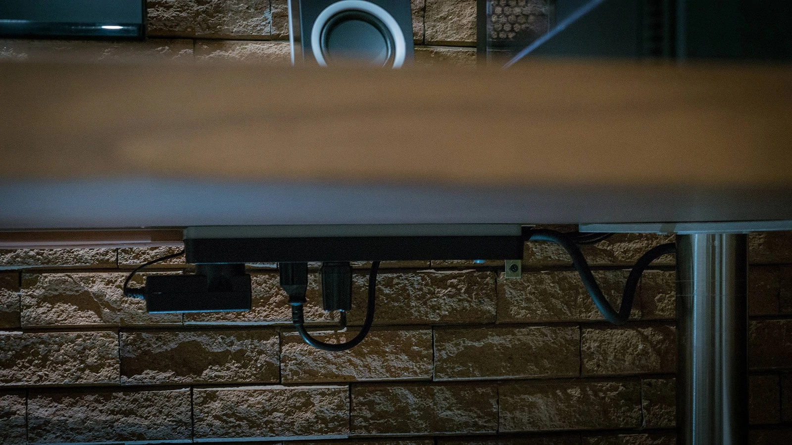 Mounted power strip for under desk cable management