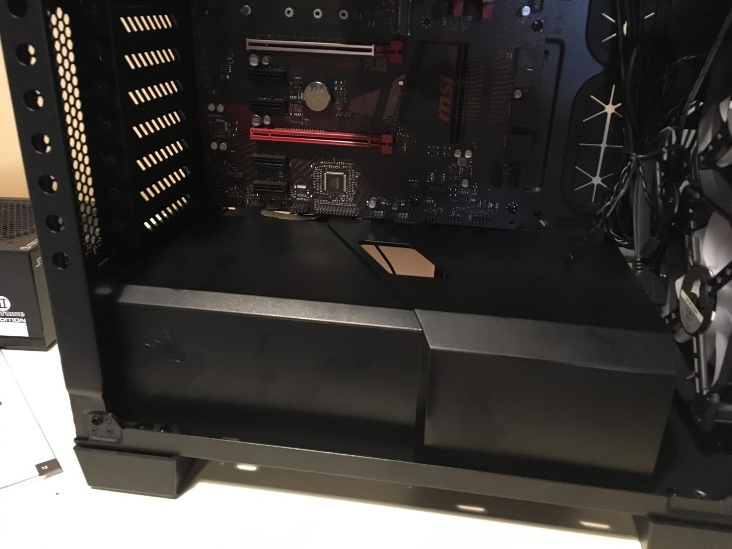 PSU shroud and routing grommets in a PC case