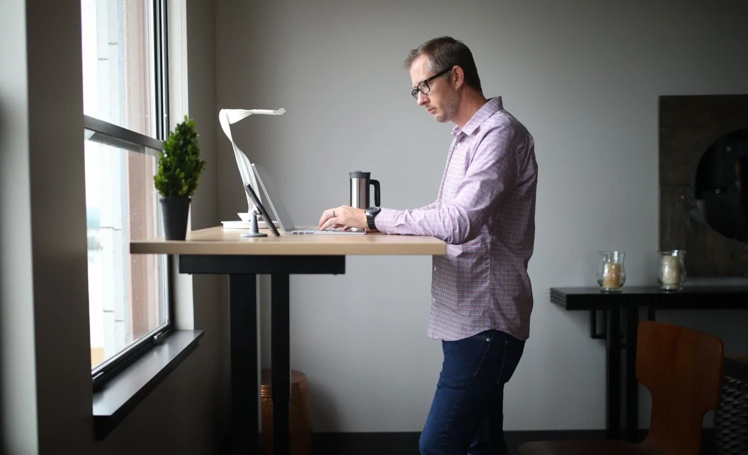 A man at a standing desk