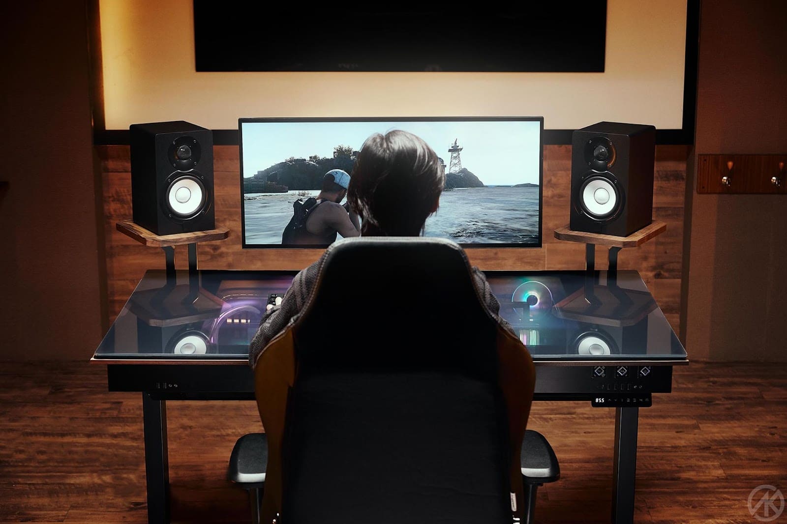 sitting and gaming at an adjustable desk setup