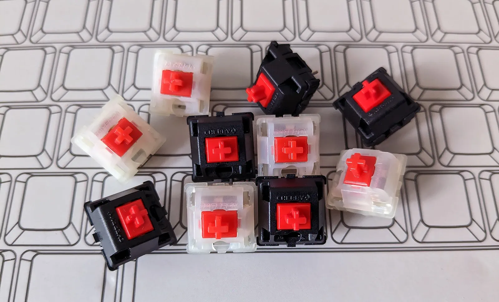 Cherry MX and Gateron switches in a pile